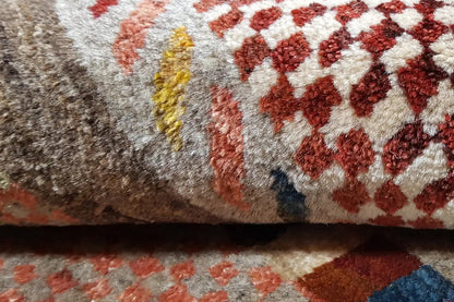 Close-up: Gabbeh rug with a dense pile and red geometric pattern