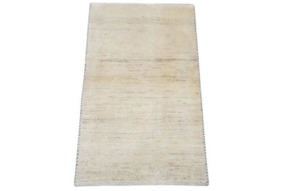 Gabbeh rug 60x53 cm, side view with beige pile and fringes along the edge