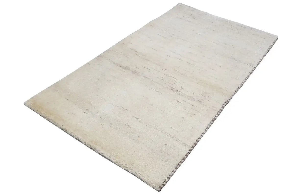 Gabbeh rug, light beige surface with fine, irregular stripes and fringes