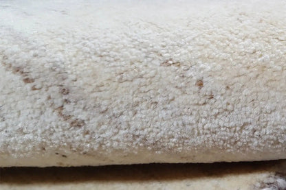 Gabbeh rug, close-up of the light beige pile with visible texture and darker spots