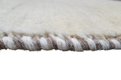 Gabbeh rug, close-up of the side fringes made of beige and brownish yarn