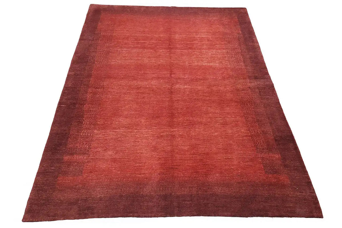 Reddish-brown carpet, broadly laid out with a mottled look and a dark border area