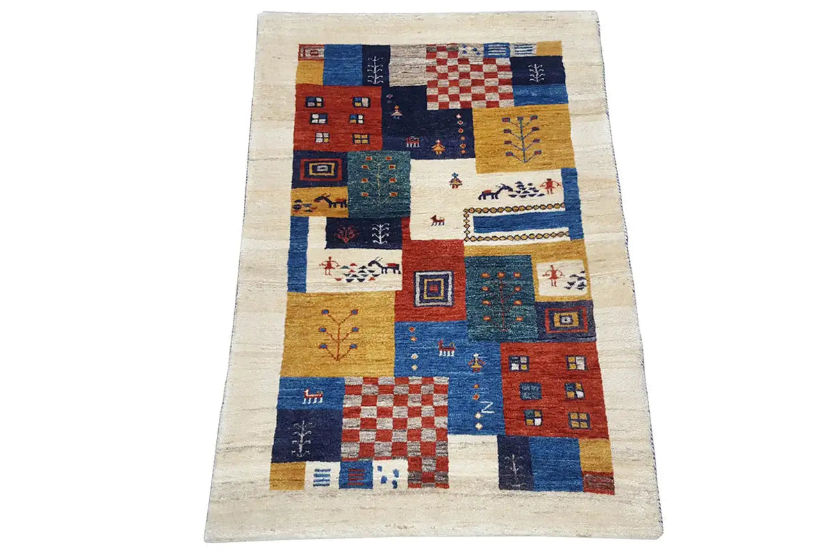 Rectangular Gabbeh rug, patchwork design with houses and diamonds in blue and red