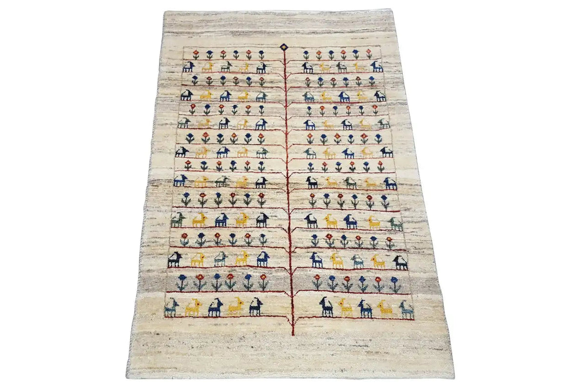 Gabbeh rug with a beige background, multicolored stripes, and stylized figures