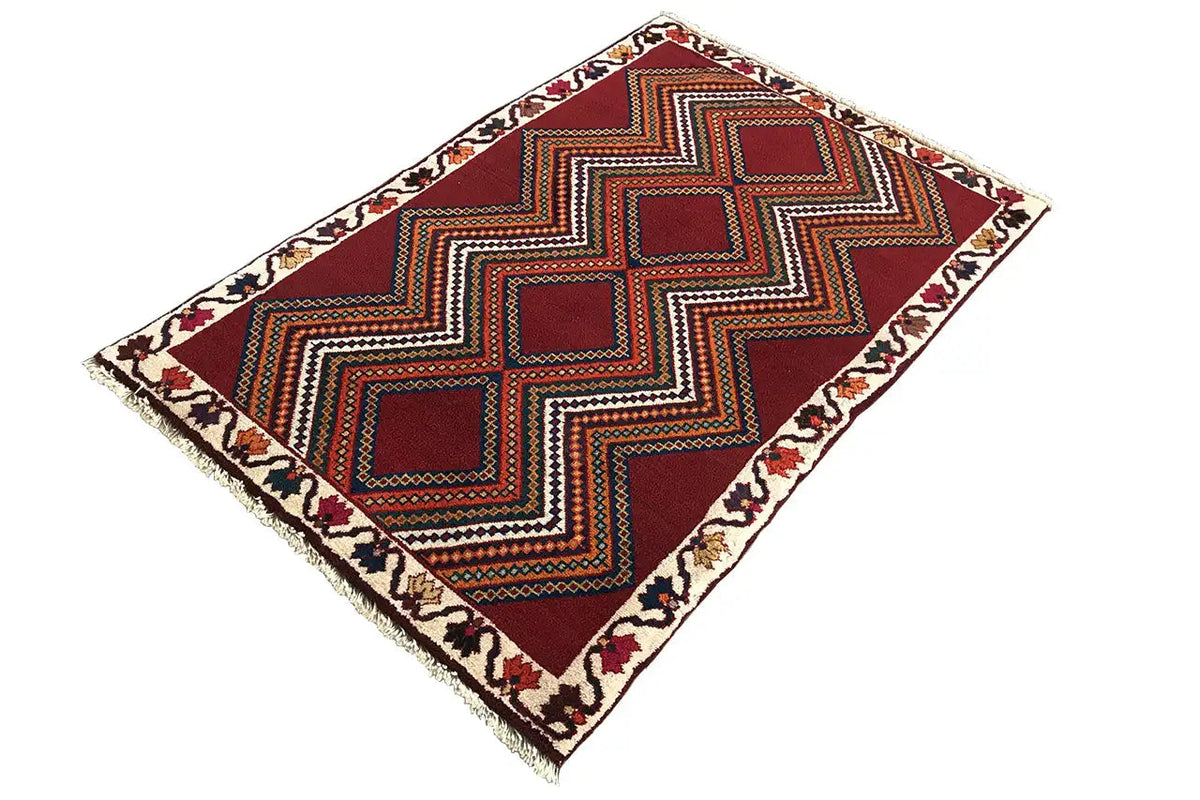 Red-brown Gabbeh rug with a zigzag pattern and diamonds, arranged diagonally