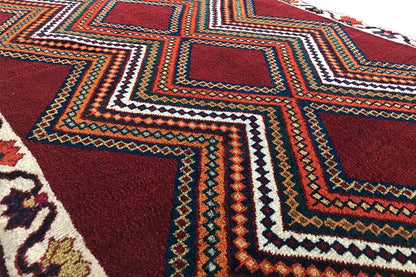 Gabbeh rug detail strip with multicolored zigzag lines and diamonds