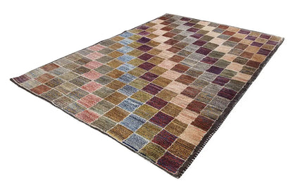 Rectangular Gabbeh rug with patchwork tiles in brown, beige, blue, and purple