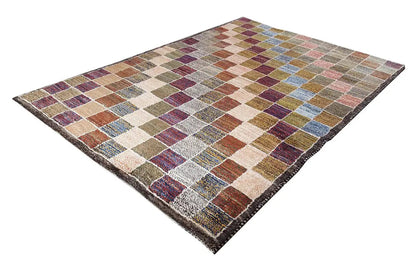 Gabbeh rug with a colorful diamond and tile pattern in warm and cool tones