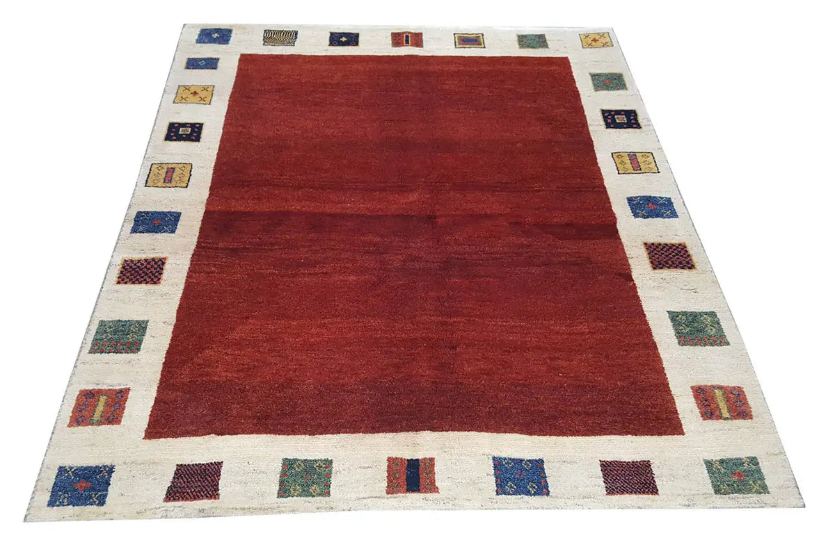 Gabbeh rug, 190x156 cm: red rectangular pattern with a beige border and square decorative panels.