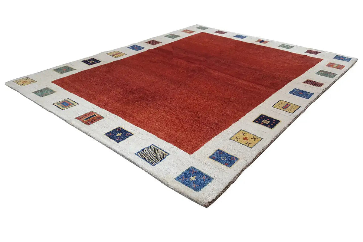 Gabbeh rug, 190x156 cm: red square/ rectangle in the center, beige border with colorful embroidered stripes.
