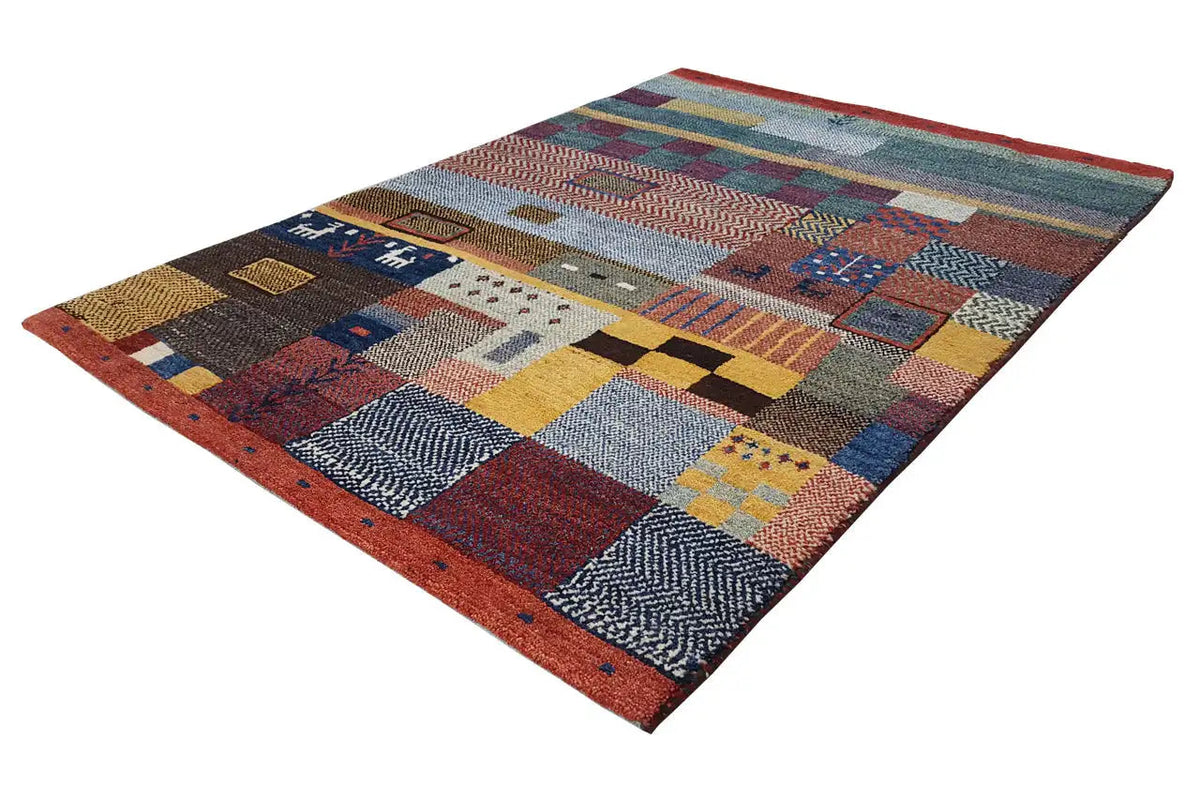 Gabbeh rug with patchwork patterns, framed in red, geometric color blocks