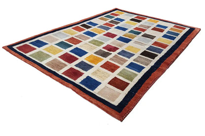 Gabbeh rug (185x135 cm) at an angle, checkered design made of colorful blocks and a border