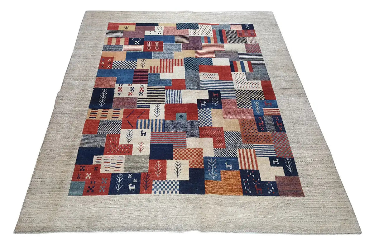Rug with a geometric patchwork pattern in red, blue, white, and beige