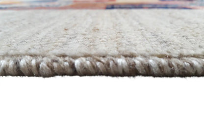 Close-up of the carpet edge with fringes and a light, dense pile