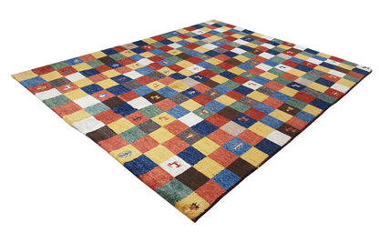 Gabbeh rug spread out, colorful checked patchwork with small figurative motifs