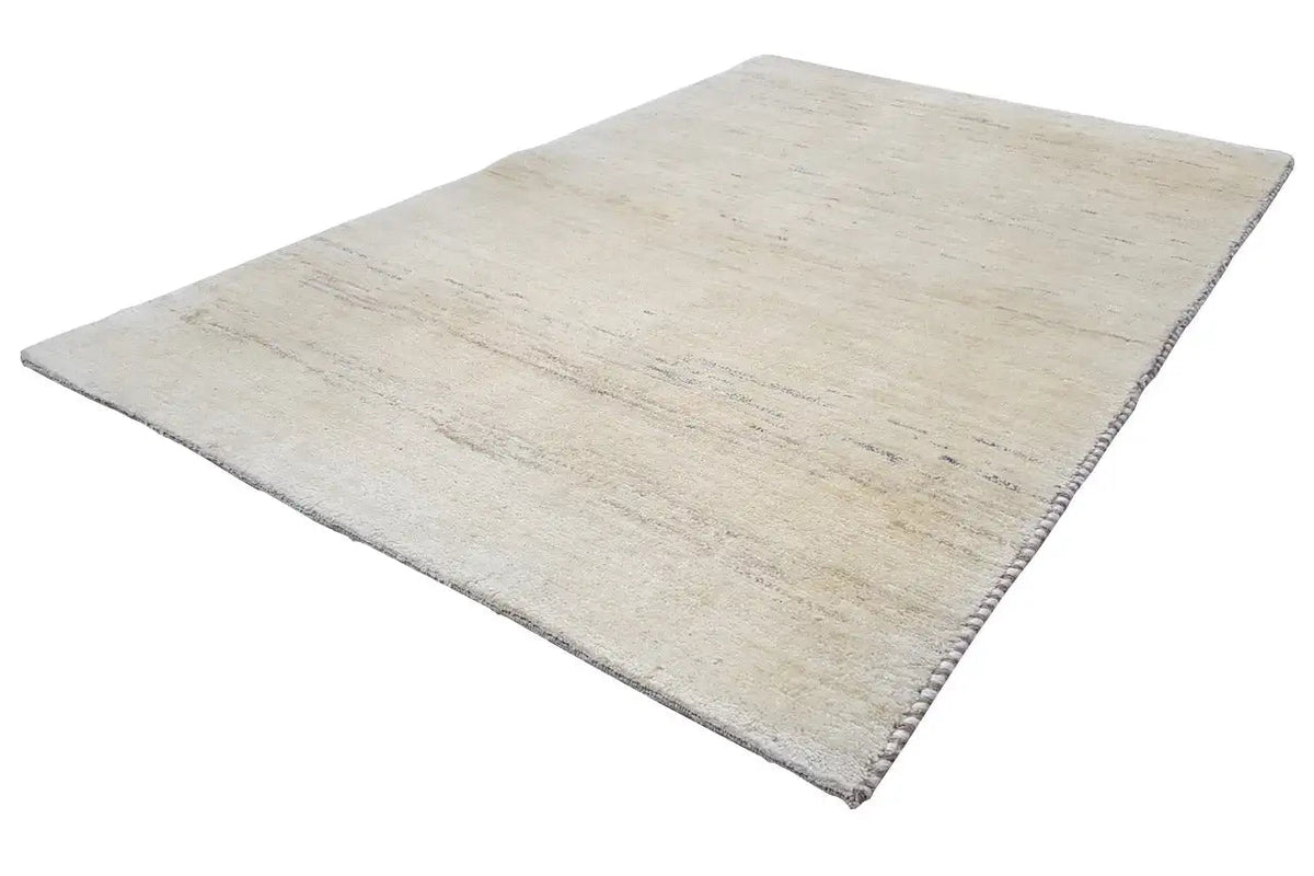 Beige Gabbeh rug with a fine, mottled pattern, rectangular.