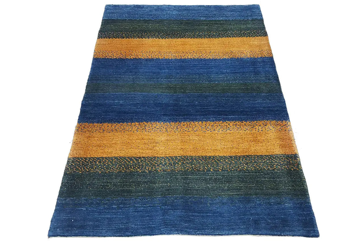 Gabbeh rug with a wide striped pattern in blue, green, and ochre, rectangular