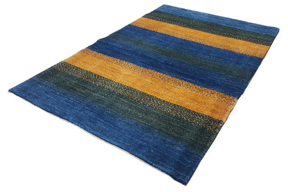 Rug with a diagonal pattern, wide stripes in blue, green, and ochre