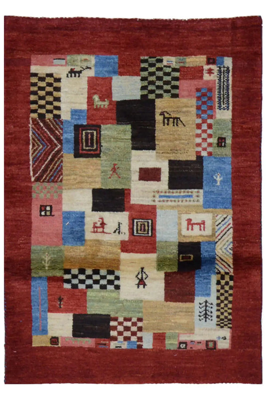 Red Gabbeh rug with patterned patchwork shapes