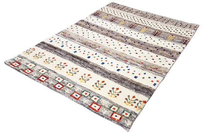 Gabbeh rug laid flat: striped pattern with colorful dots and diamonds