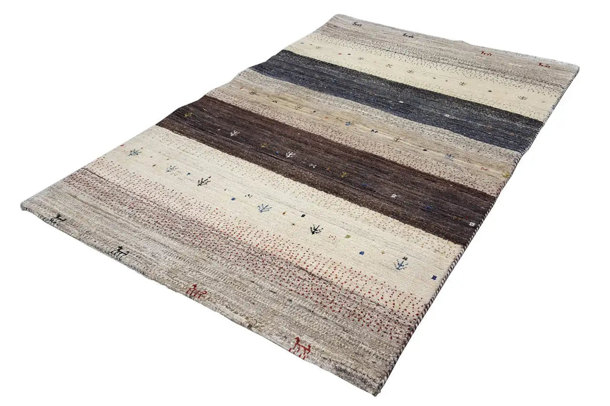 Gabbeh rug with stripes of beige, dark blue, and brown sections