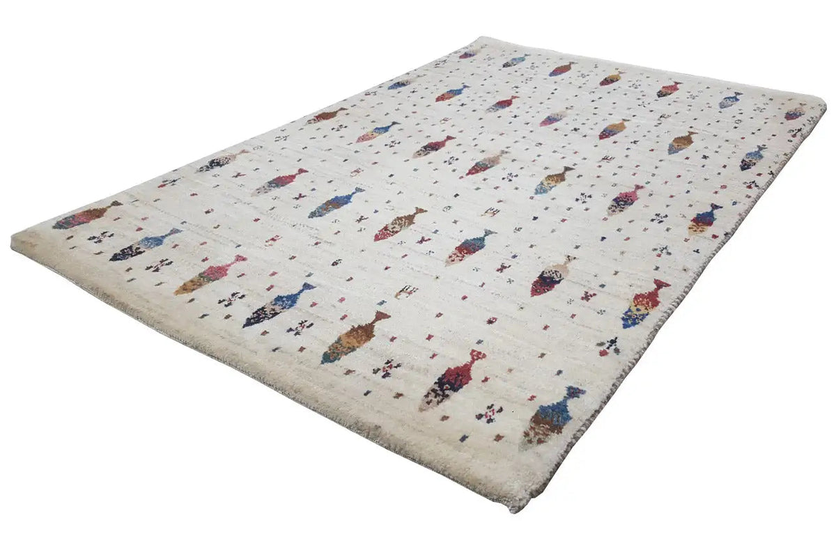 Cream Gabbeh rug with a colorful figure pattern, rectangular, pile edge visible