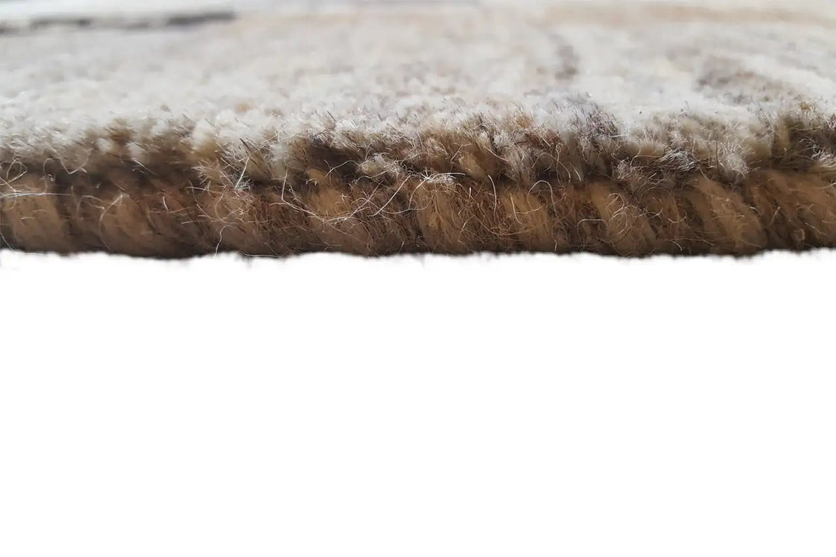 Rug edge with a dense, short pile; multicolored in beige and gray