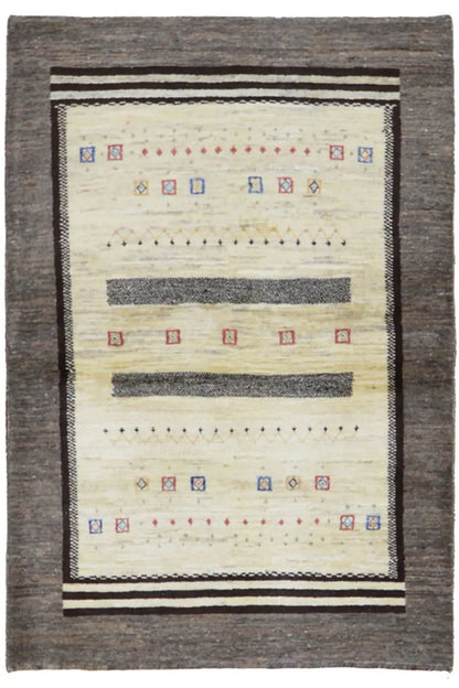 Gabbeh rug with a cream-colored pattern, dark gray border, and decorative stripes