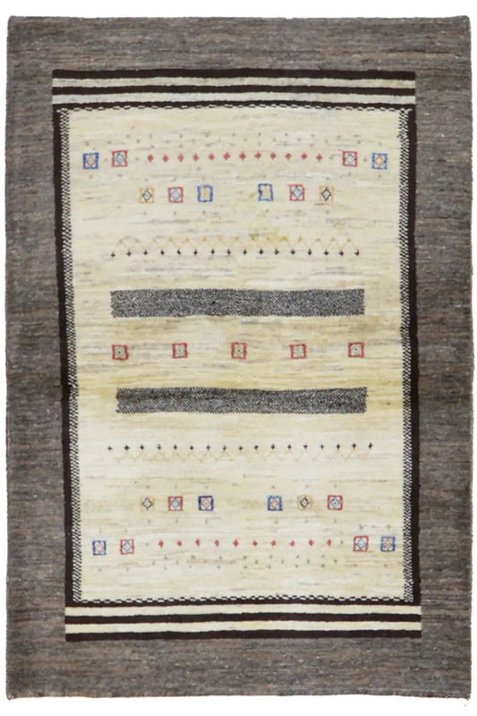 Gabbeh rug with a cream-colored pattern, dark gray border, and decorative stripes