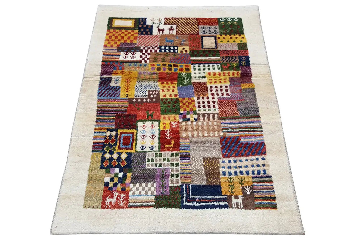 Gabbeh rug, rectangular, with a colorful pattern on a light background