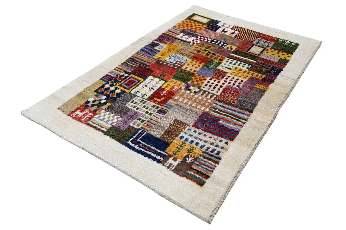 Gabbeh rug with a geometric patchwork pattern, light background field