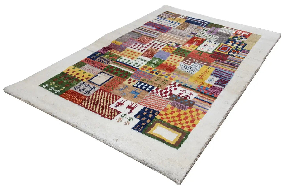 Gabbeh rug with multicolored squares and stripes on a light background