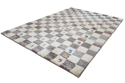 Gabbeh rug with a checkered pattern in beige and gray and colorful cross symbols