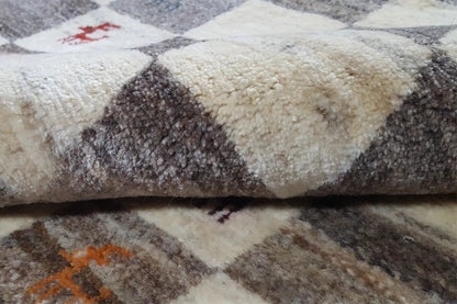 Gabbeh rug with beige and dark gray pile, pattern with colorful accents