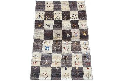 Gabbeh rug (94x60 cm) with a checked pattern and small animal motifs, multicolored