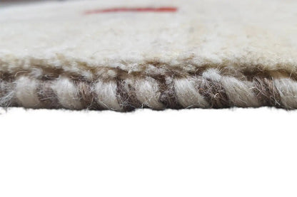 Gabbeh rug, edge view: short pile and edging with slight fringe