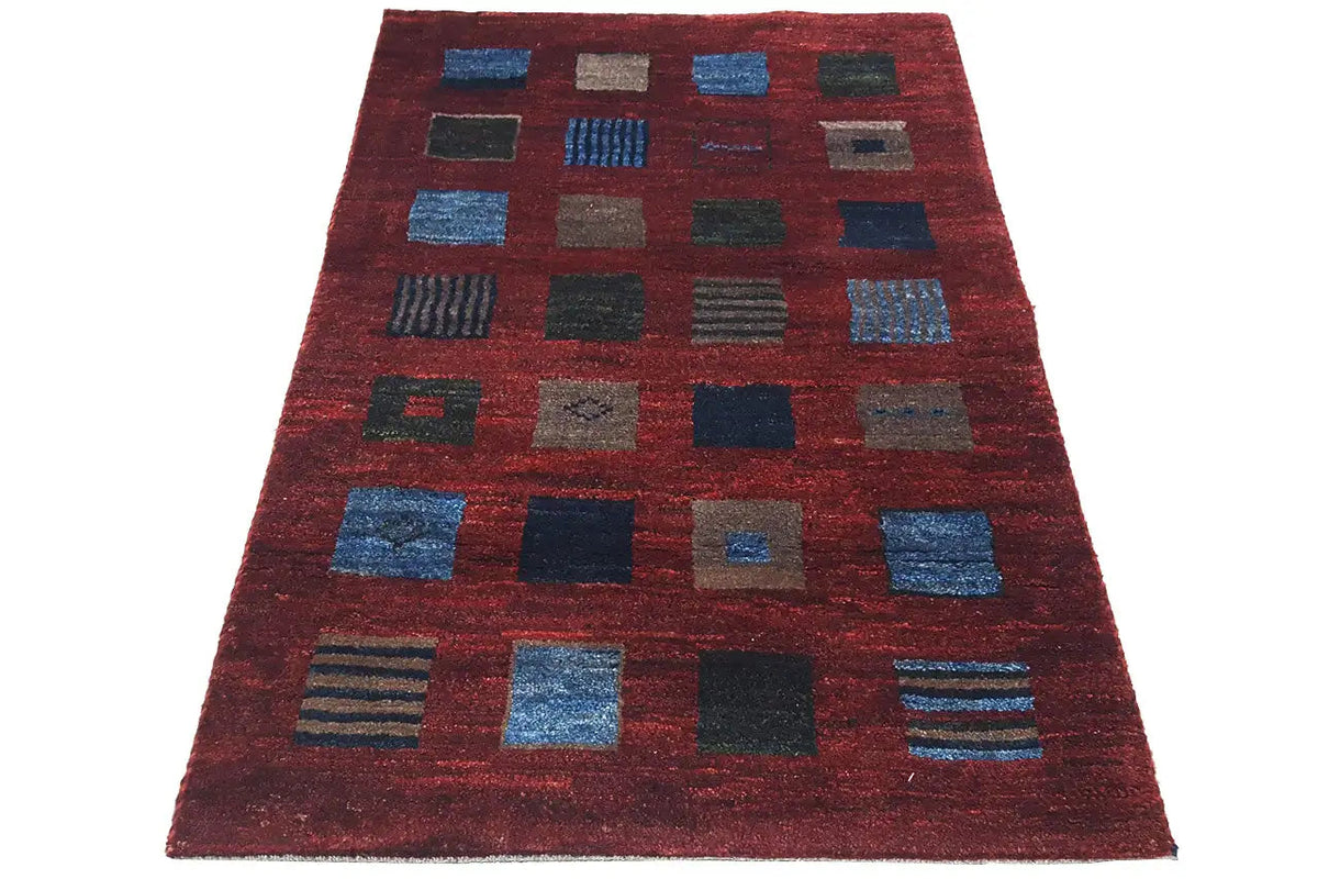 Gabbeh rug 124x80 cm: reddish-brown pattern with blue and gray squares