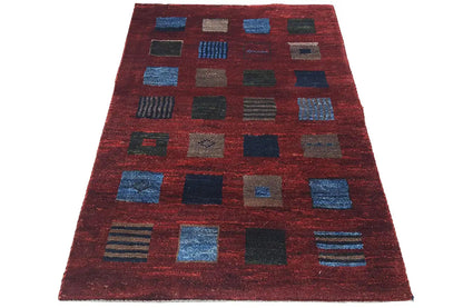 Gabbeh rug 124x80 cm: reddish-brown pattern with blue and gray squares