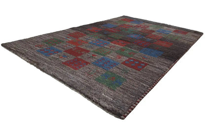 Gabbeh rug with colorful patchwork ornaments on a dark background, square motifs