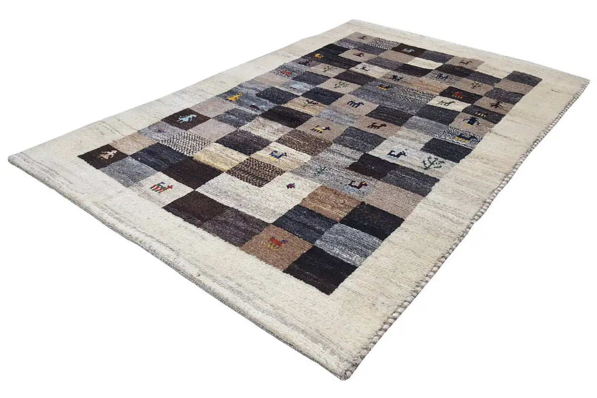 Gabbeh rug lying flat, beige border, dark diamond pattern with colorful animal motifs