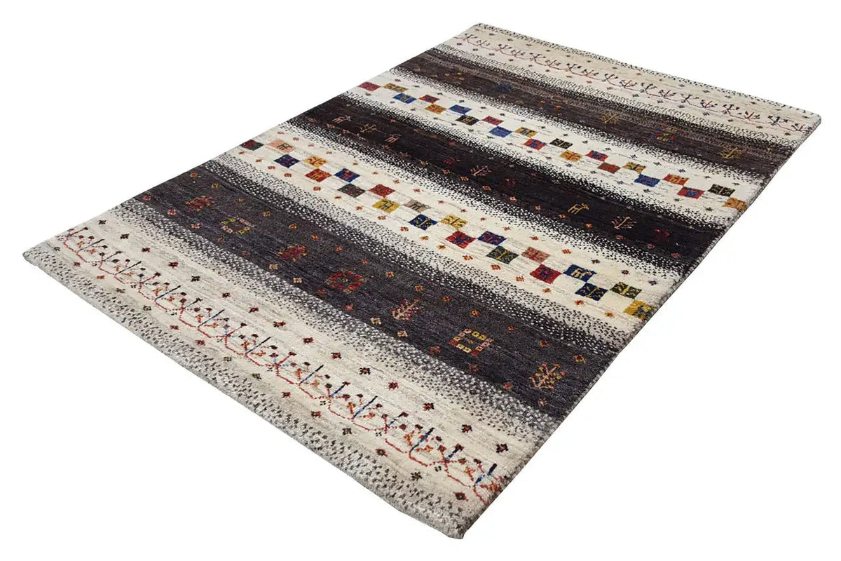 Rug viewed at an angle, striped borders with colorful squares on a light background