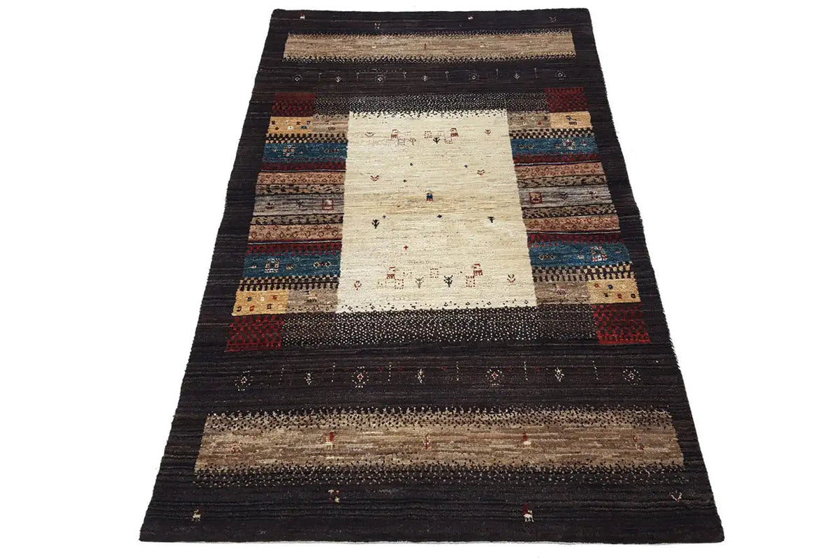 Rectangular Gabbeh rug with a dark border, a central light area, and striped borders