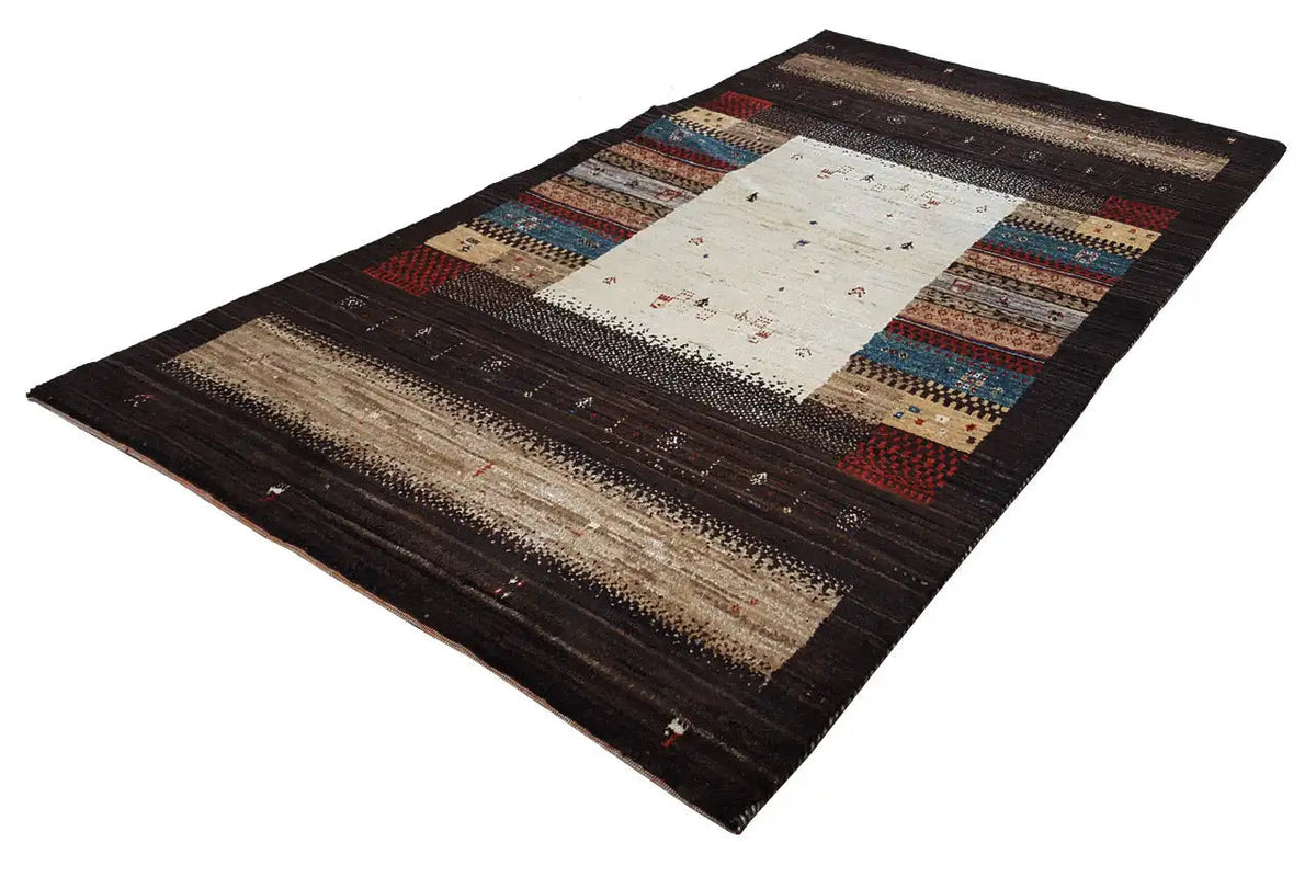 Rectangular Gabbeh rug with a central cream-colored field and surrounding borders