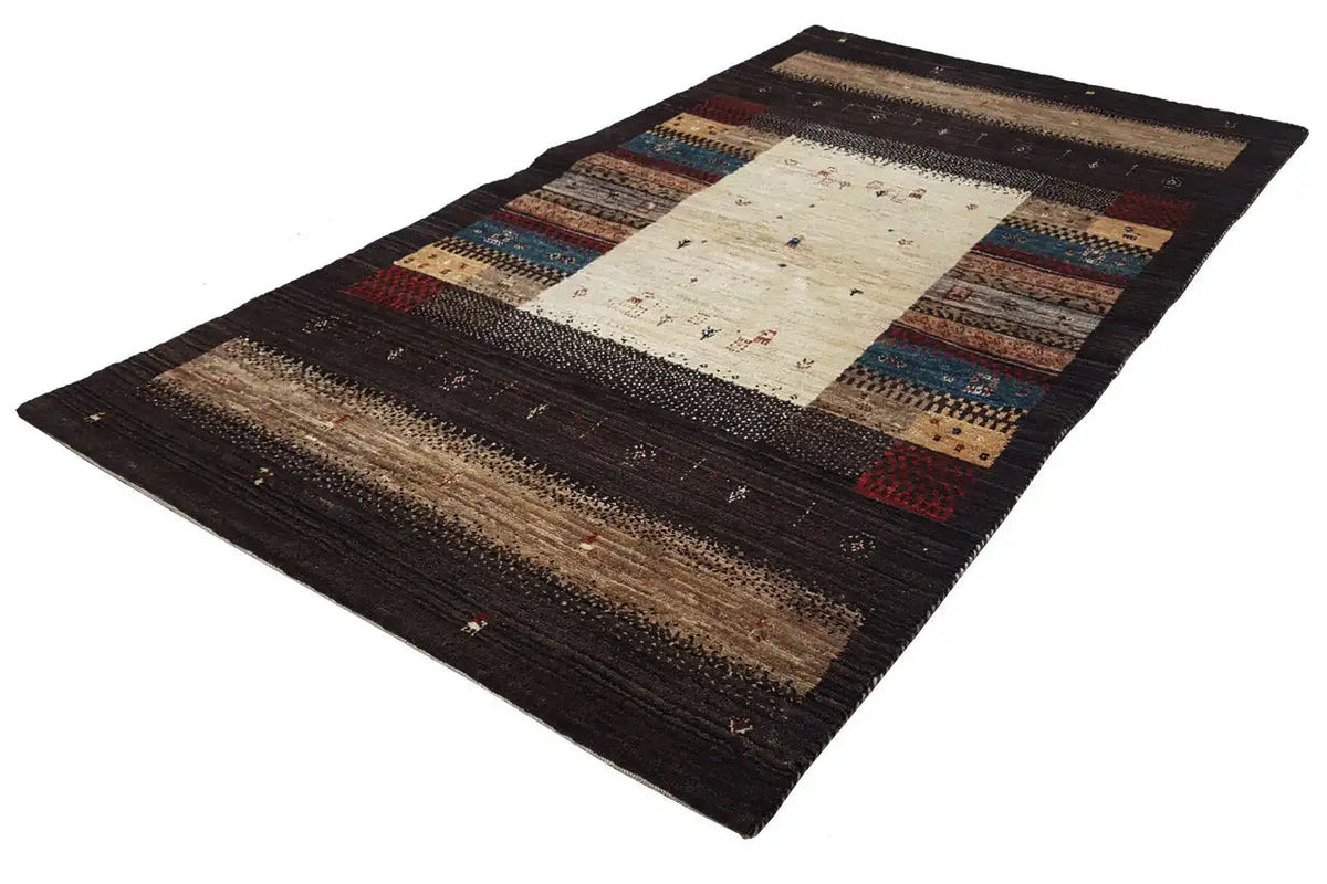 Rectangular Gabbeh rug, cream-colored central field, dark borders with multicolored patterns
