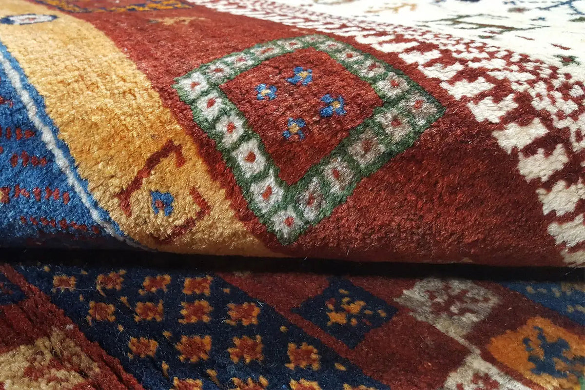 Gabbeh rug close-up: colorful pile with multicolored patterns