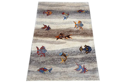 Rug with animal figures in a repeating pattern and stripes, light gray with brown accents