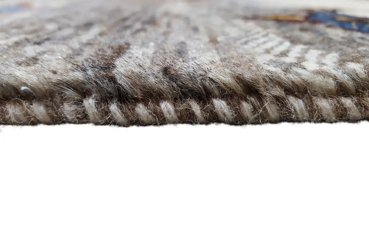 Close-up of the pile edge: dense, short wool pile over a light background