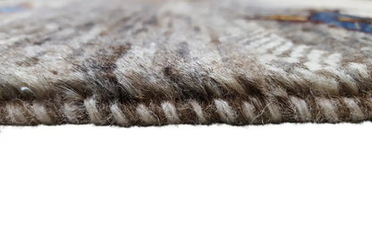 Close-up of the pile edge: dense, short wool pile over a light background