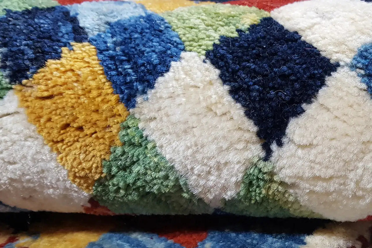 Close-up: soft carpet pile with colorful triangles and dots