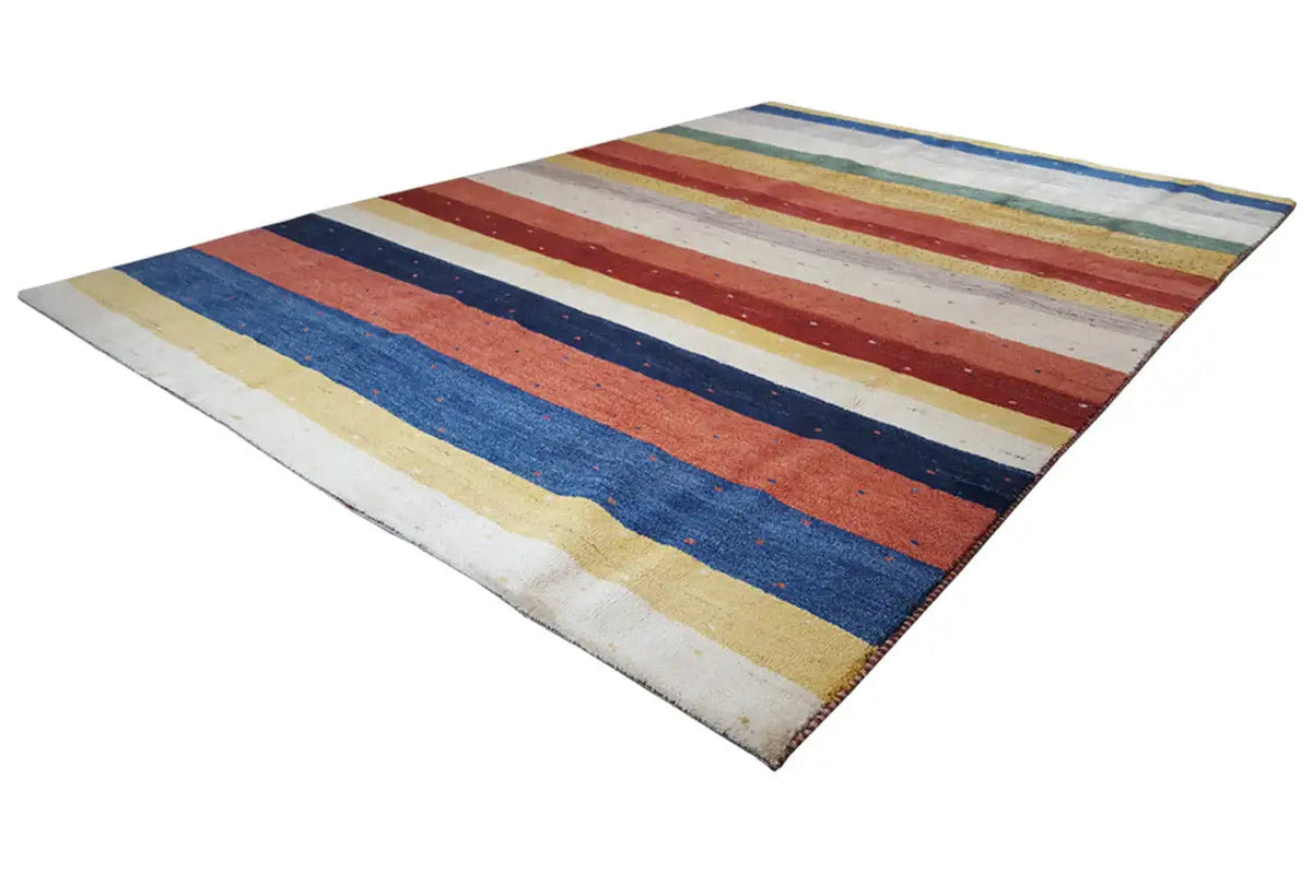 Gabbeh rug with multicolored stripes in blue, red, beige, and yellow, diagonal perspective